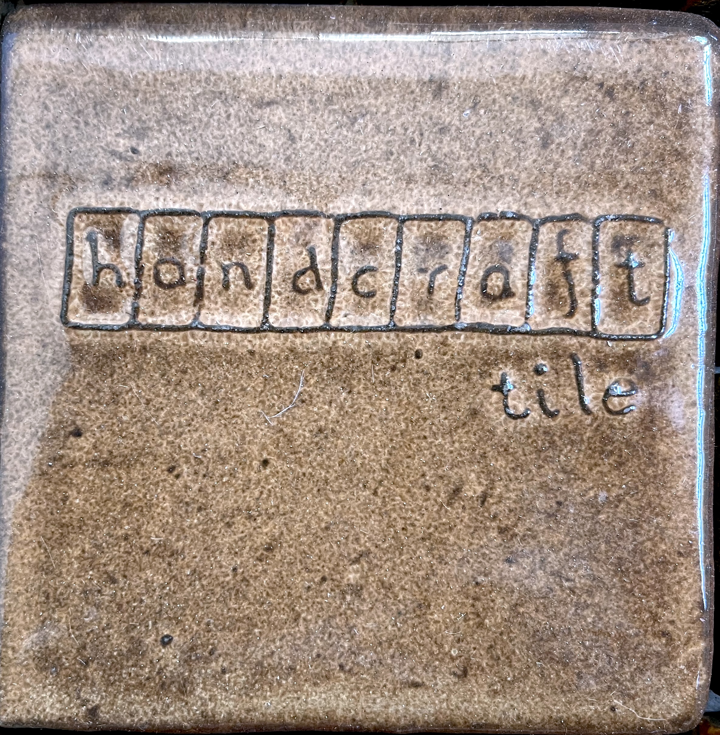 Handcraft Tile block-letter mark